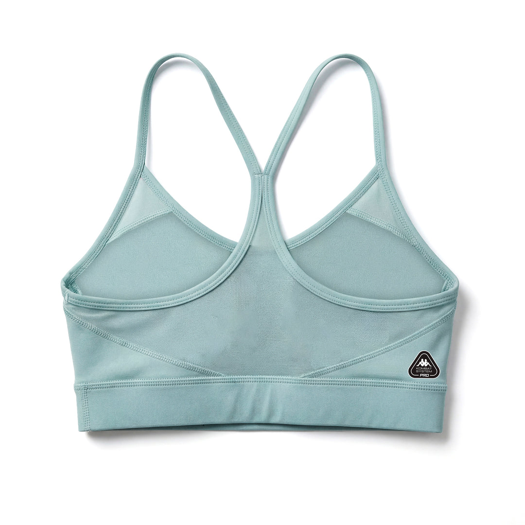 Haut de sport bleu moulant pour femme avec empiècements en mesh main