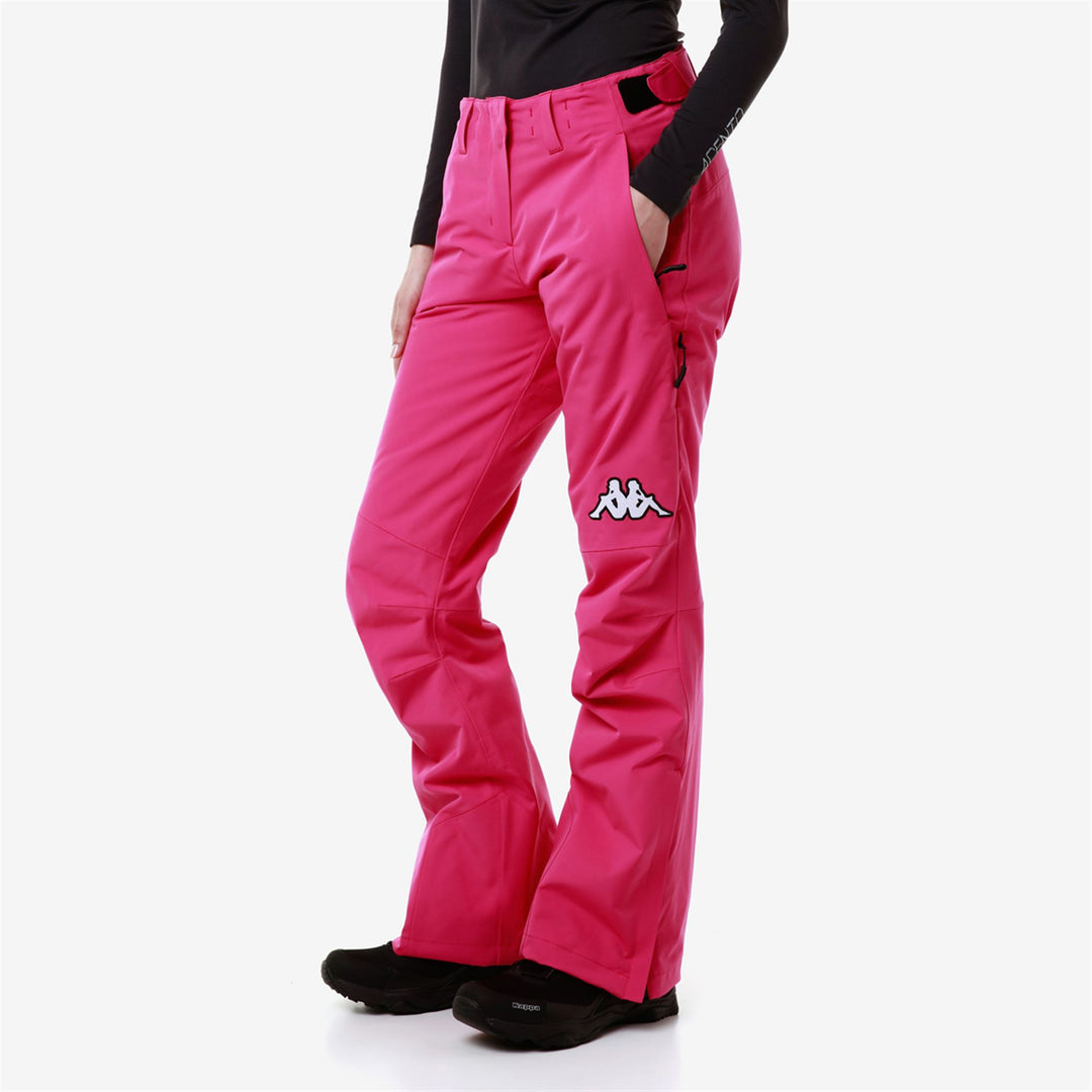 Pantalon de ski imperméable rembourré coupe slim pour femme, couleur fuchsia main