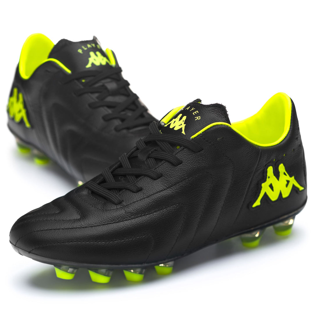 Botas de fútbol de corte bajo para hombre, color negro neón amarillo, para terrenos firmes main
