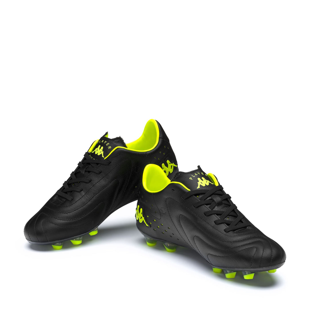 Botas de fútbol de corte bajo para hombre, color negro neón amarillo, para terrenos firmes main