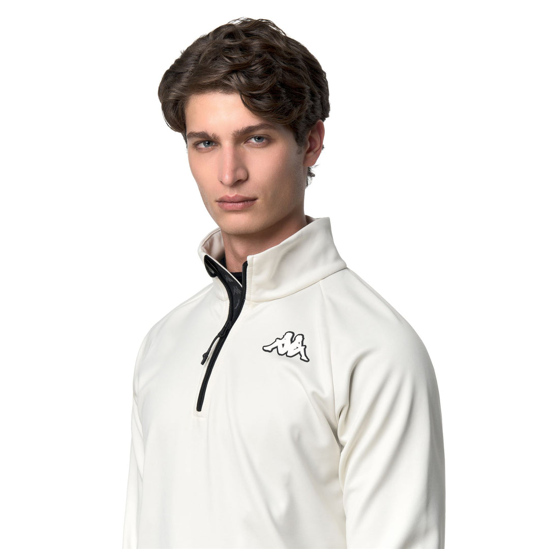 Chaqueta polar unisex blanca con media cremallera y corte entallado main