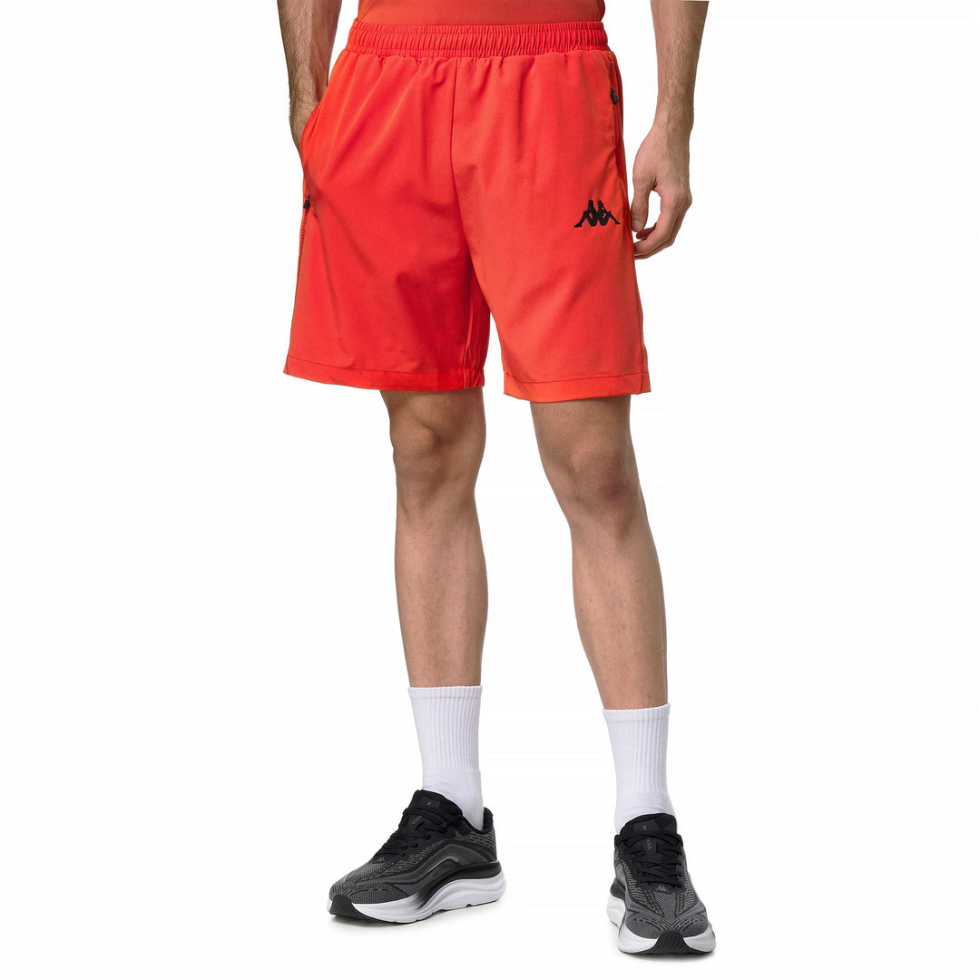 Pantalones cortos deportivos ajustados de color naranja para hombre confeccionados en tejido elástico tejido 01