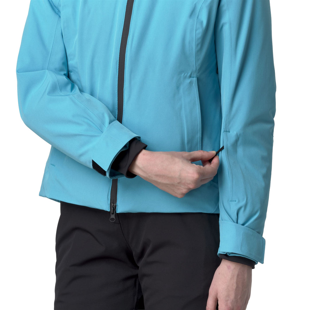 Veste de ski rembourrée bleue pour femme, coupe ajustée, avec protection imperméable main