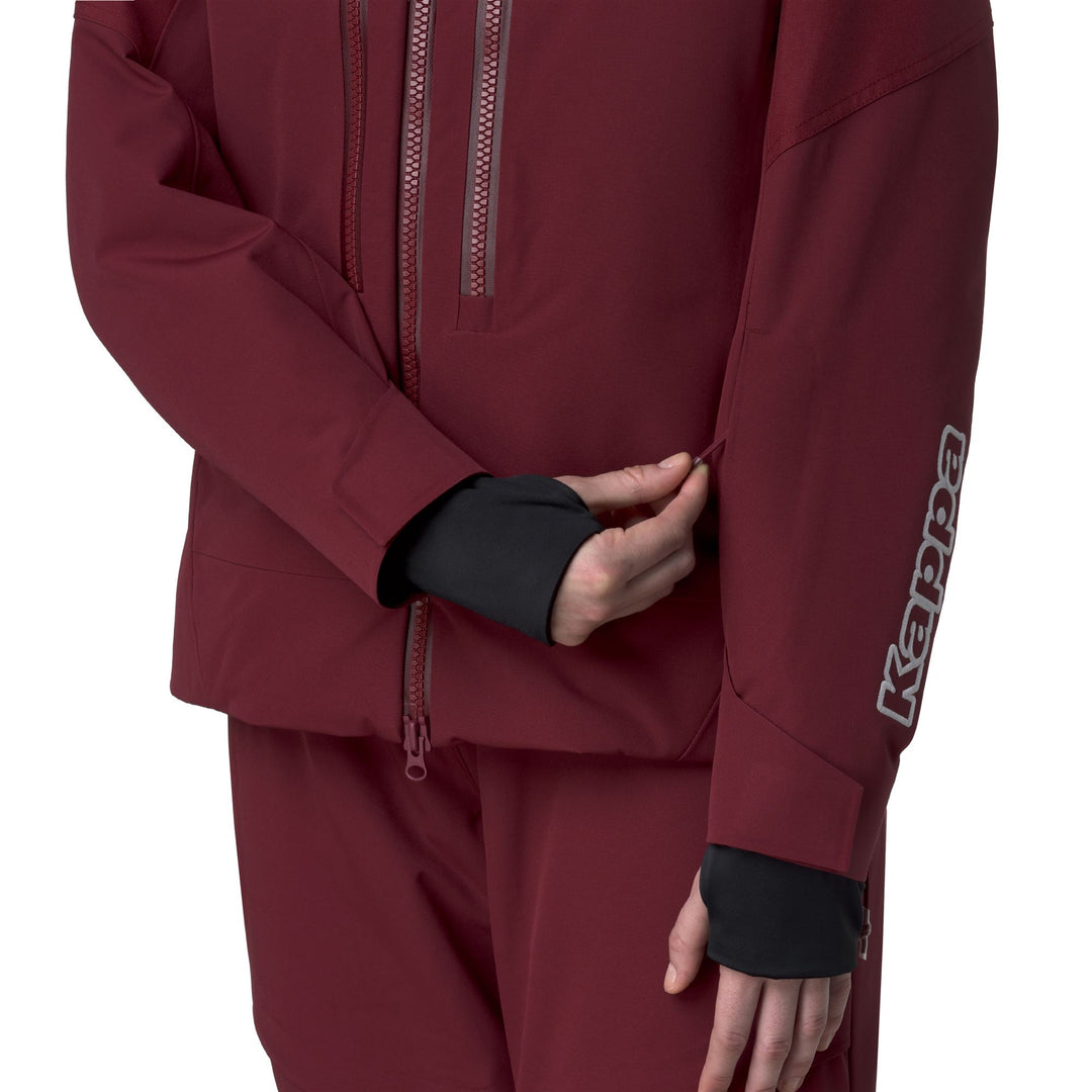 Veste de ski rouge pour femme, imperméable et isolante. main