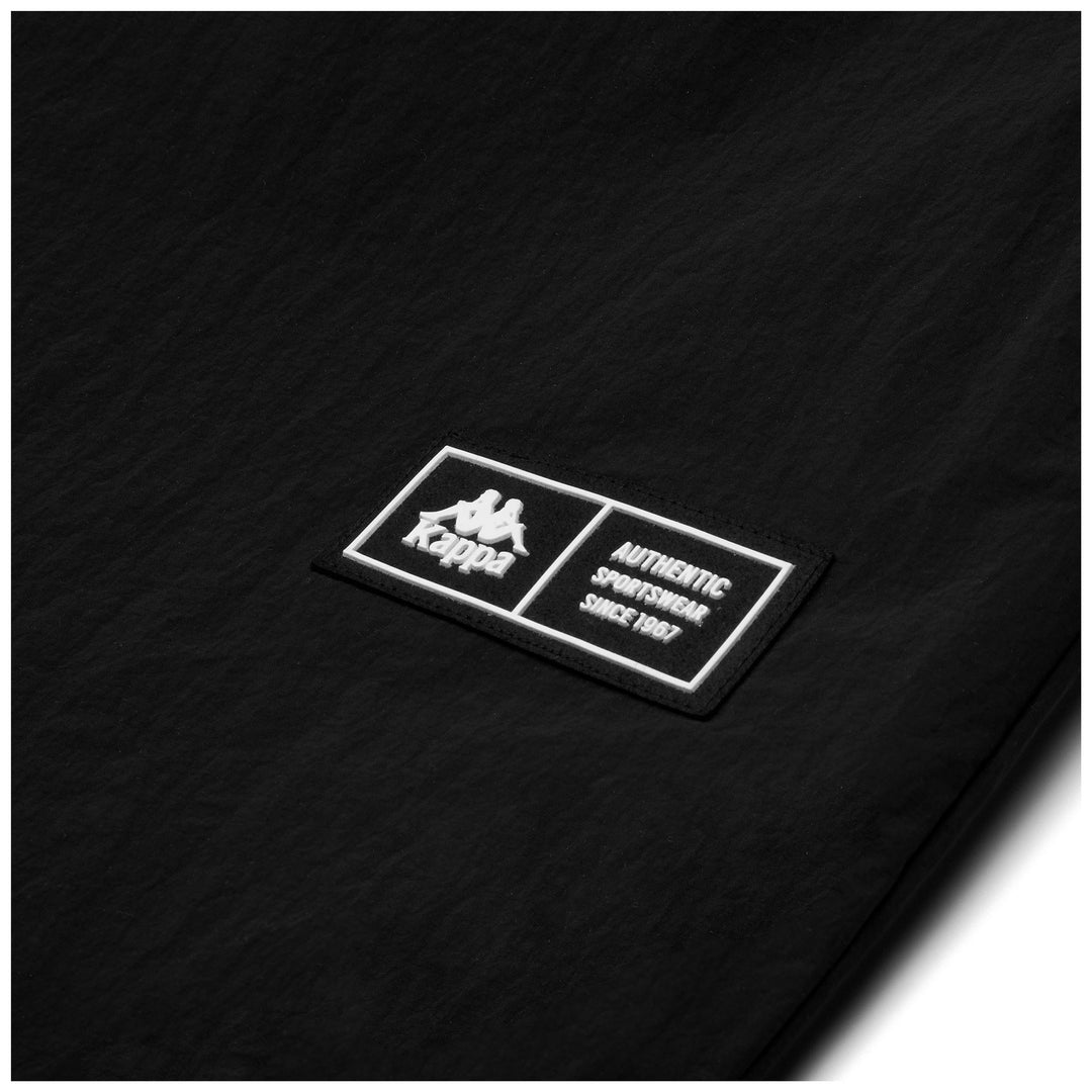 Pantalones deportivos negros de nailon para hombre, de pierna ancha y cintura elástica. main