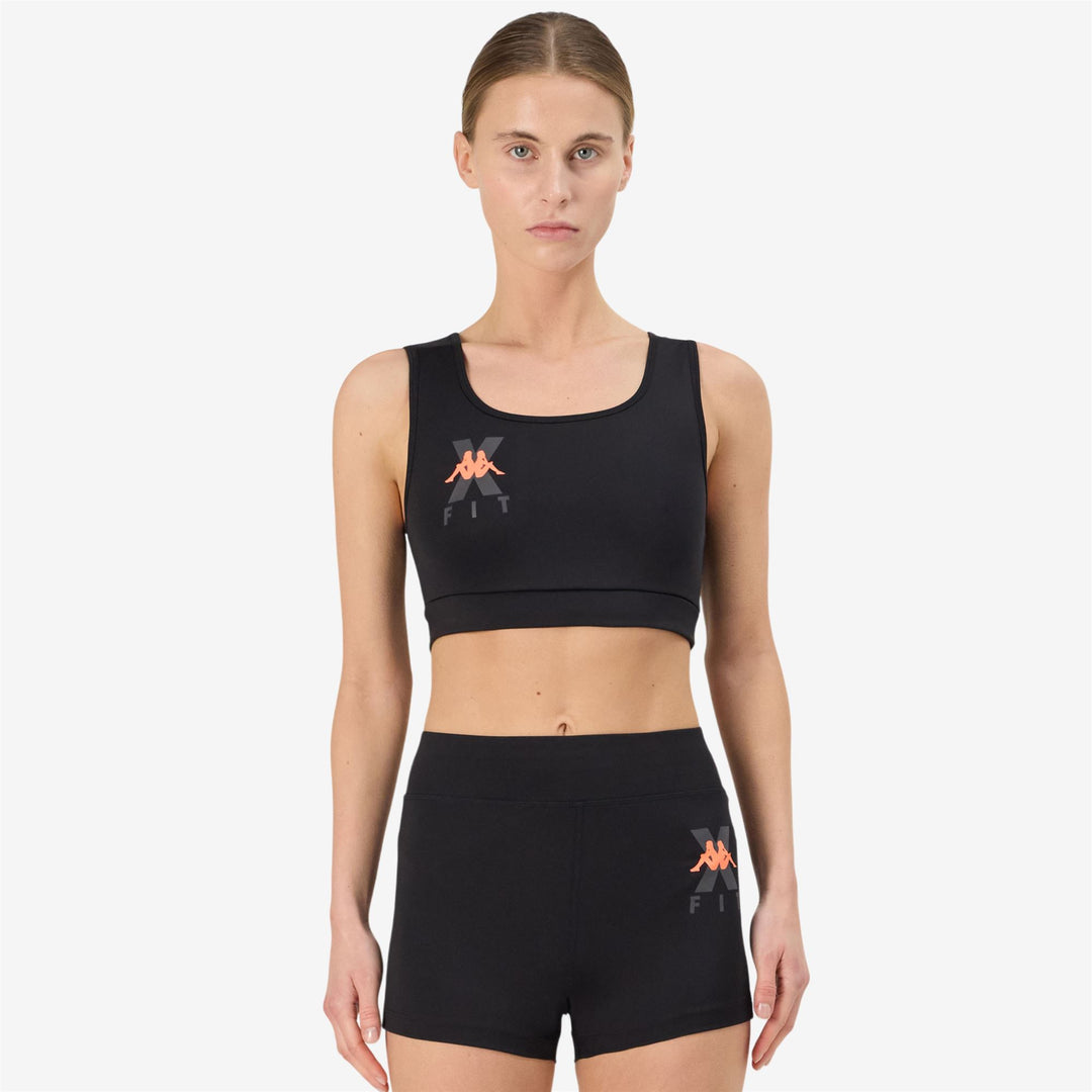 Haut en jersey stretch moulant noir pour femme main
