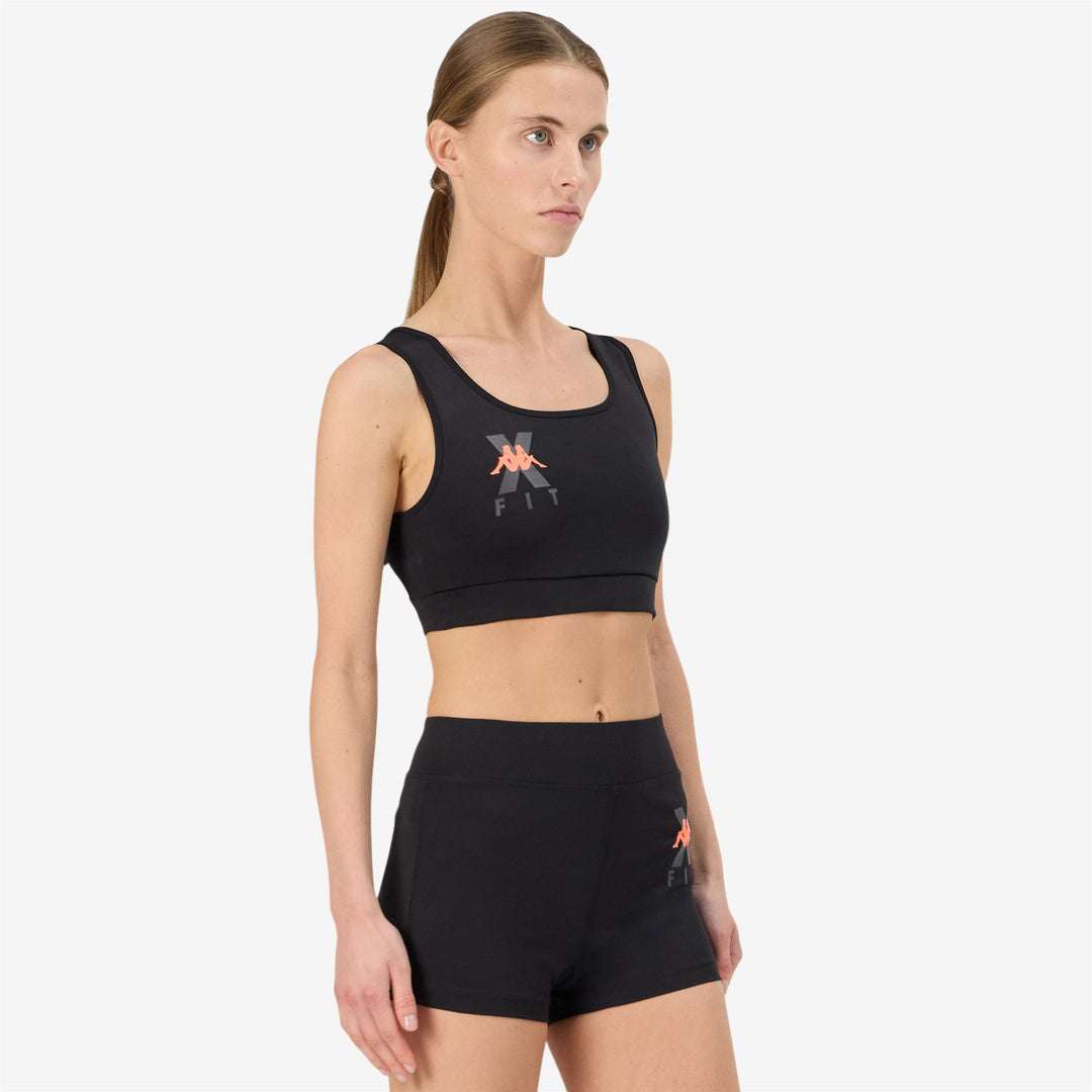 Haut en jersey stretch moulant noir pour femme main