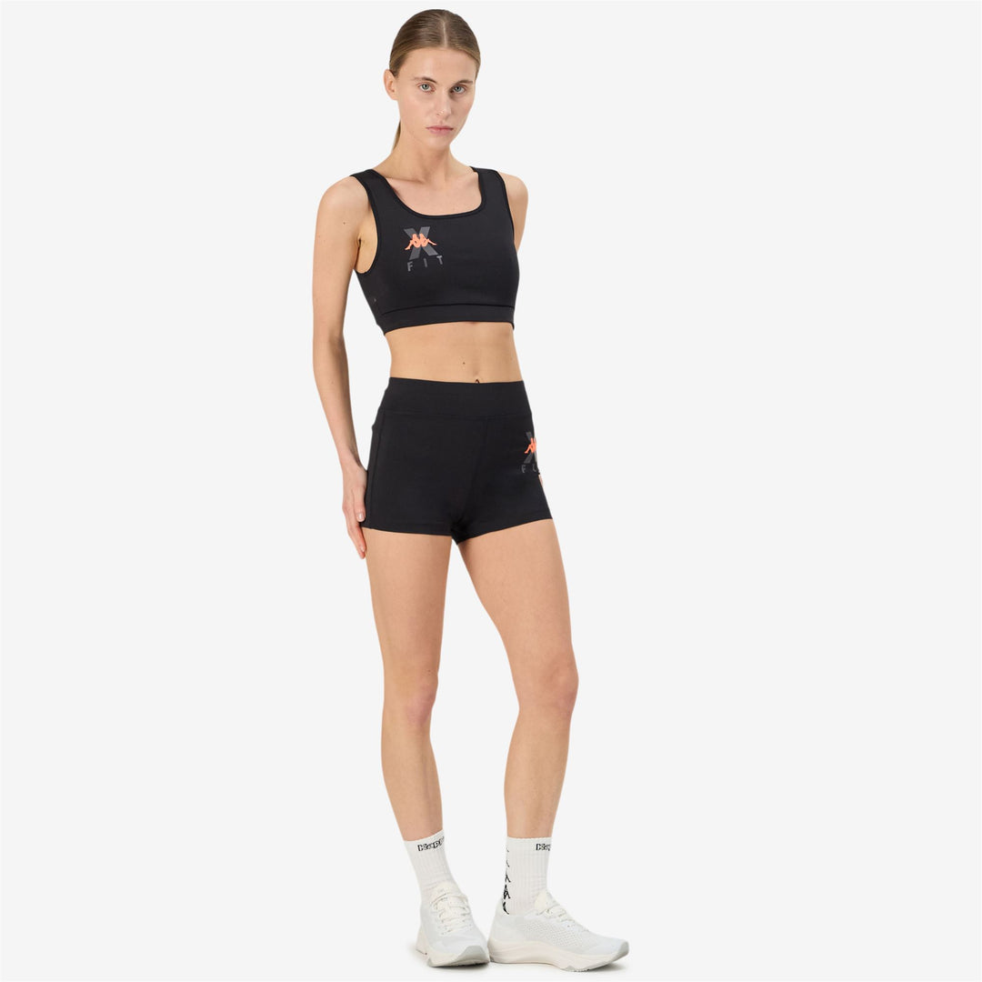 Haut en jersey stretch moulant noir pour femme main