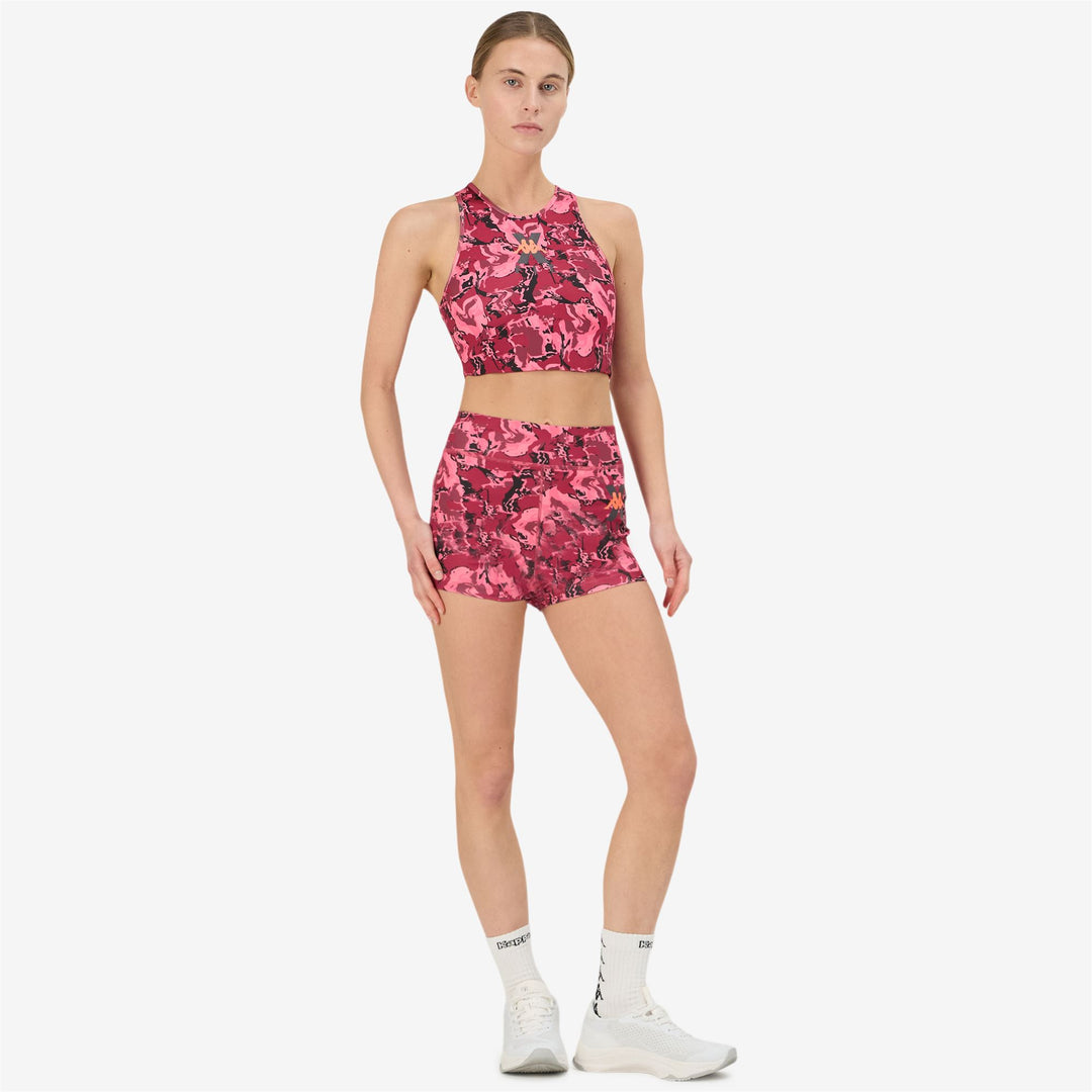 Haut de sport moulant pour femme, en jersey extensible rouge main