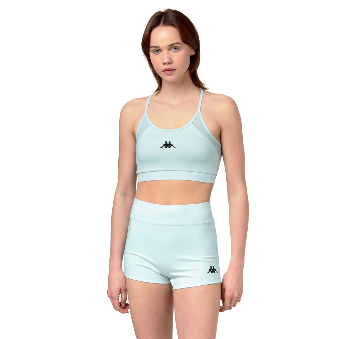 Haut de sport bleu moulant pour femme avec empiècements en mesh 01
