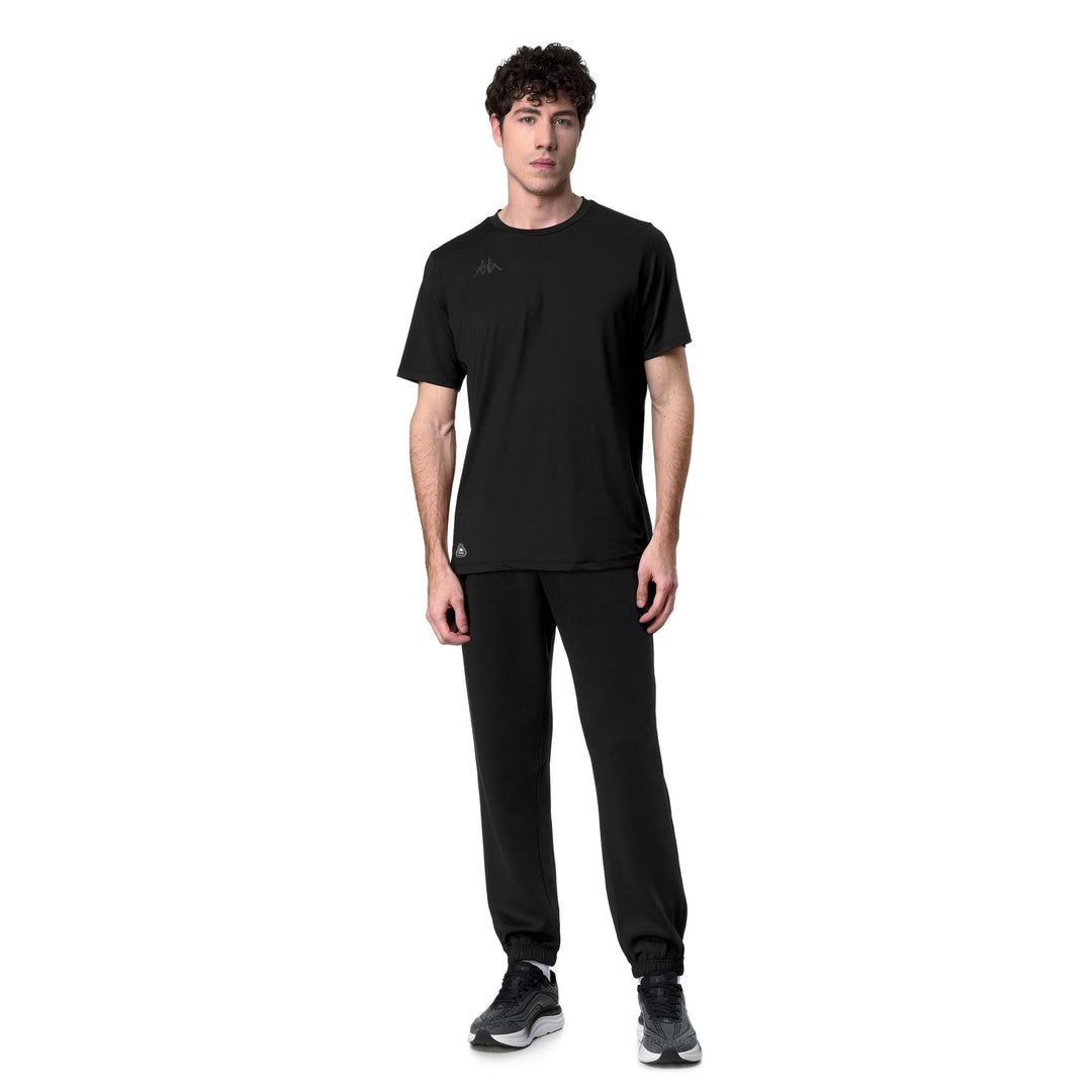 Pantalones de entrenamiento negros de corte regular para hombre en tejido interlock main