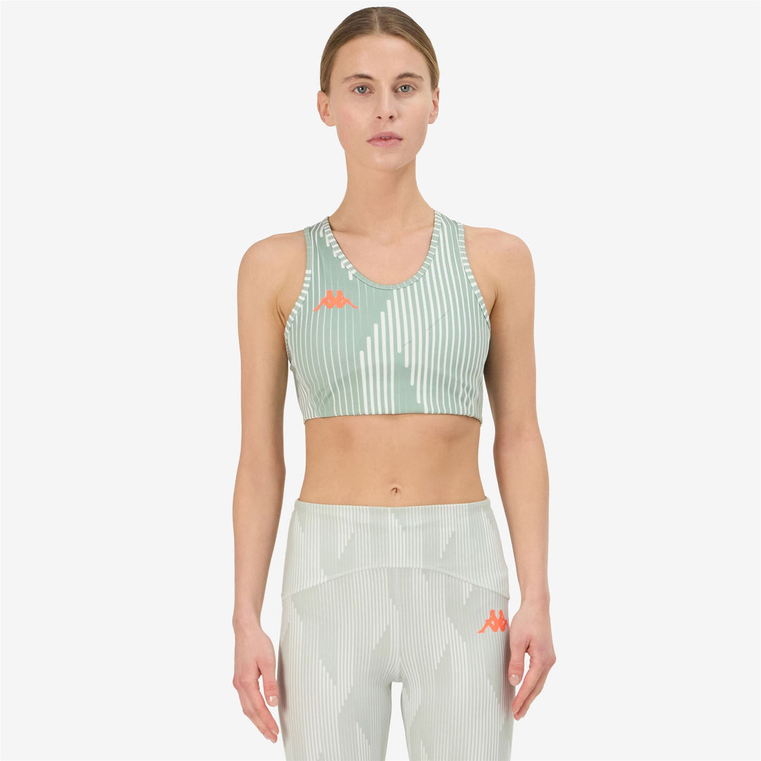 Haut d'entraînement gris moulant pour femme en jersey stretch main