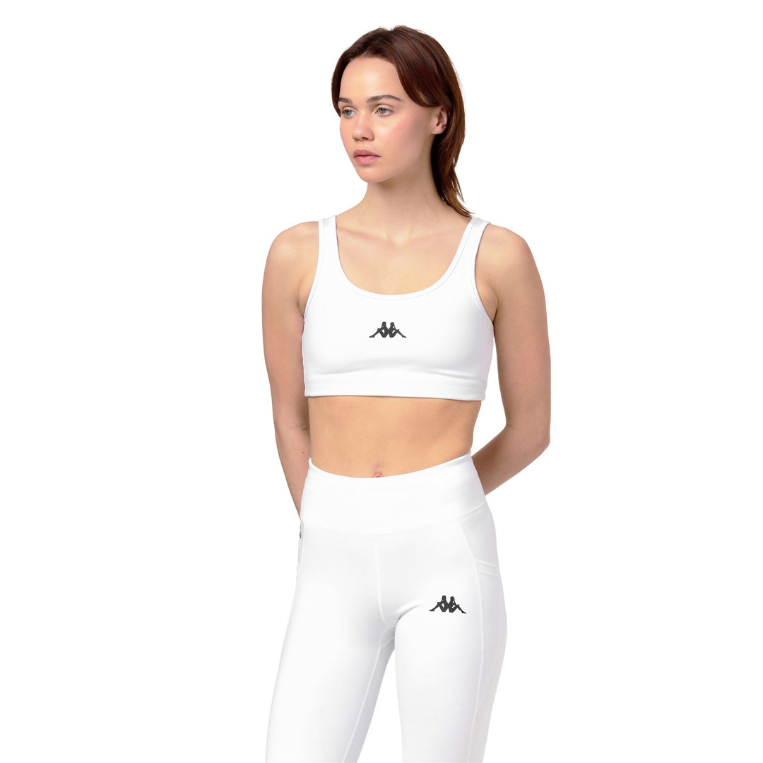 Haut d'entraînement moulant et extensible blanc pour femme 01