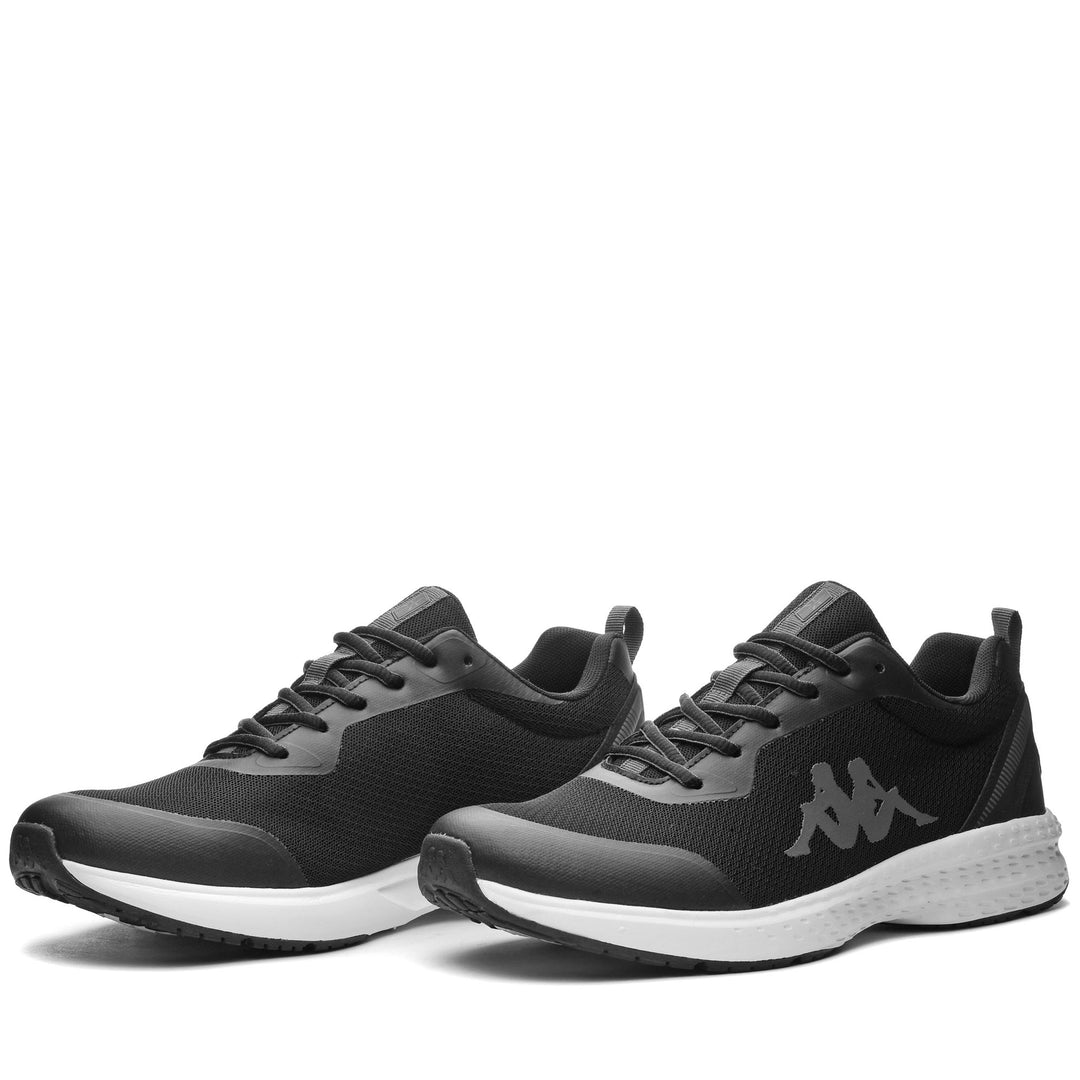 Chaussures d'entraînement basses noires unisexes avec empeigne en mesh main