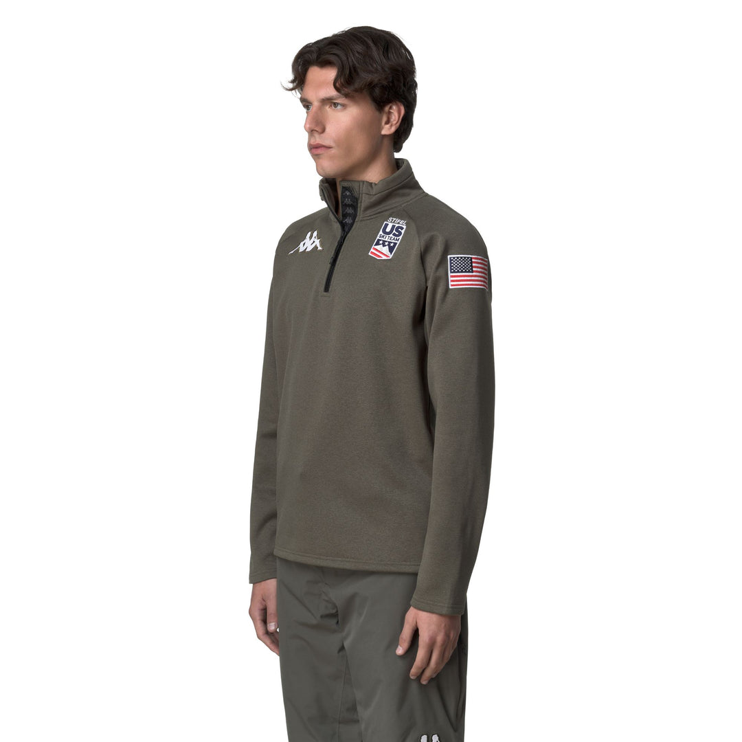 Cárdigan unisex de polar verde con media cremallera y corte entallado main