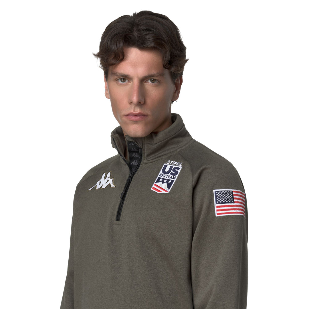 Cárdigan unisex de polar verde con media cremallera y corte entallado main