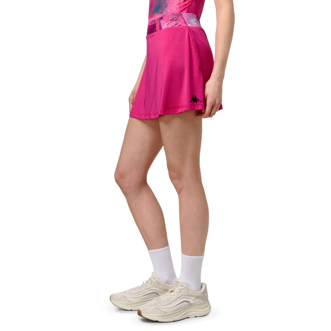 Jupe de padel violette pour femme, coupe ajustée, avec short intégré extensible main
