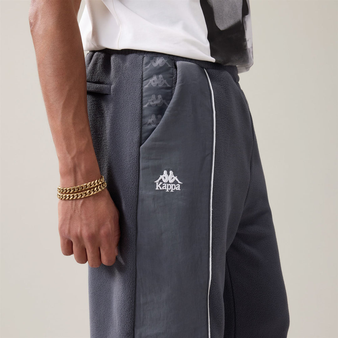 Pantalon de sport gris pour homme, coupe confort, avec passepoil et poche zippée main