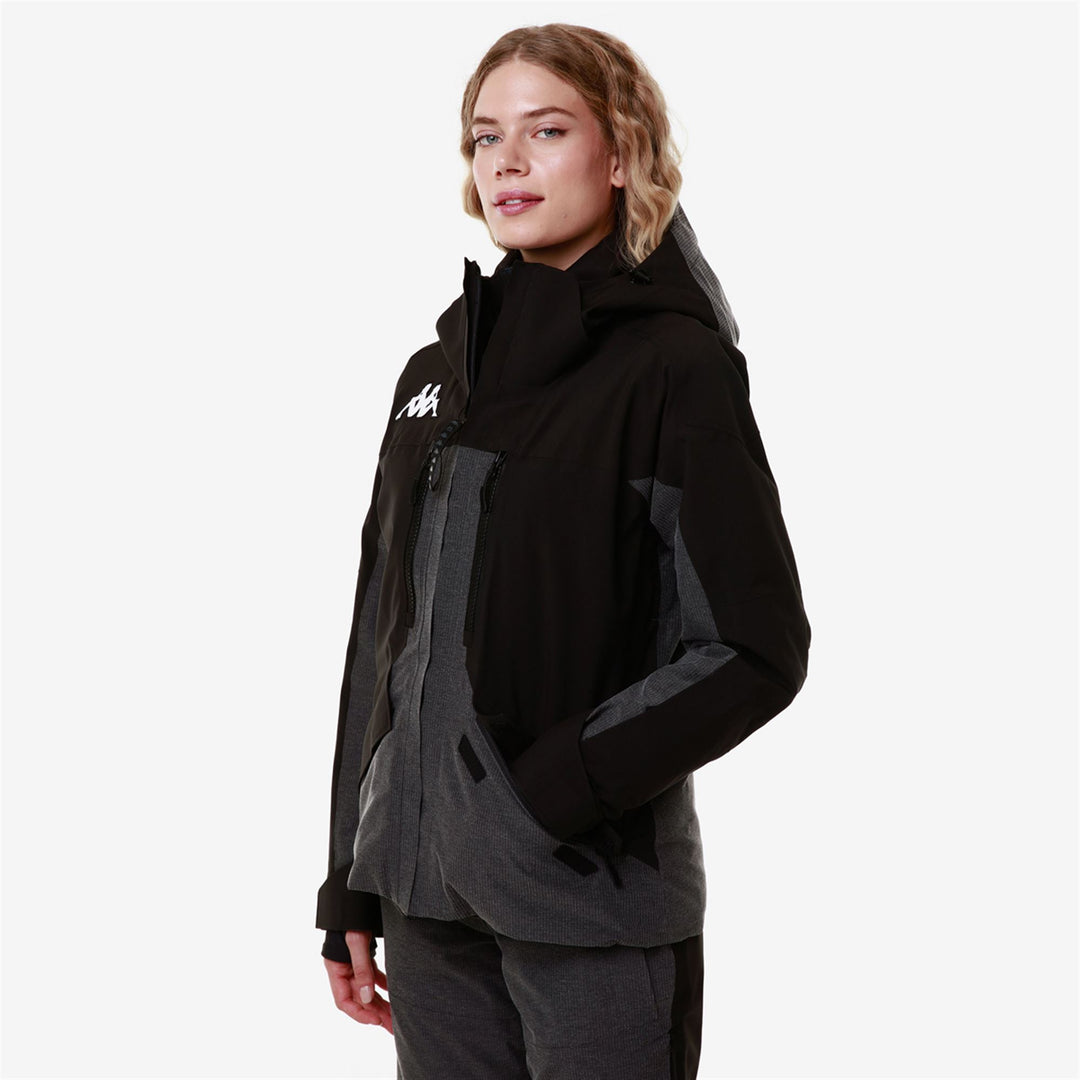 Veste de ski matelassée noire pour femme avec technologie imperméable main