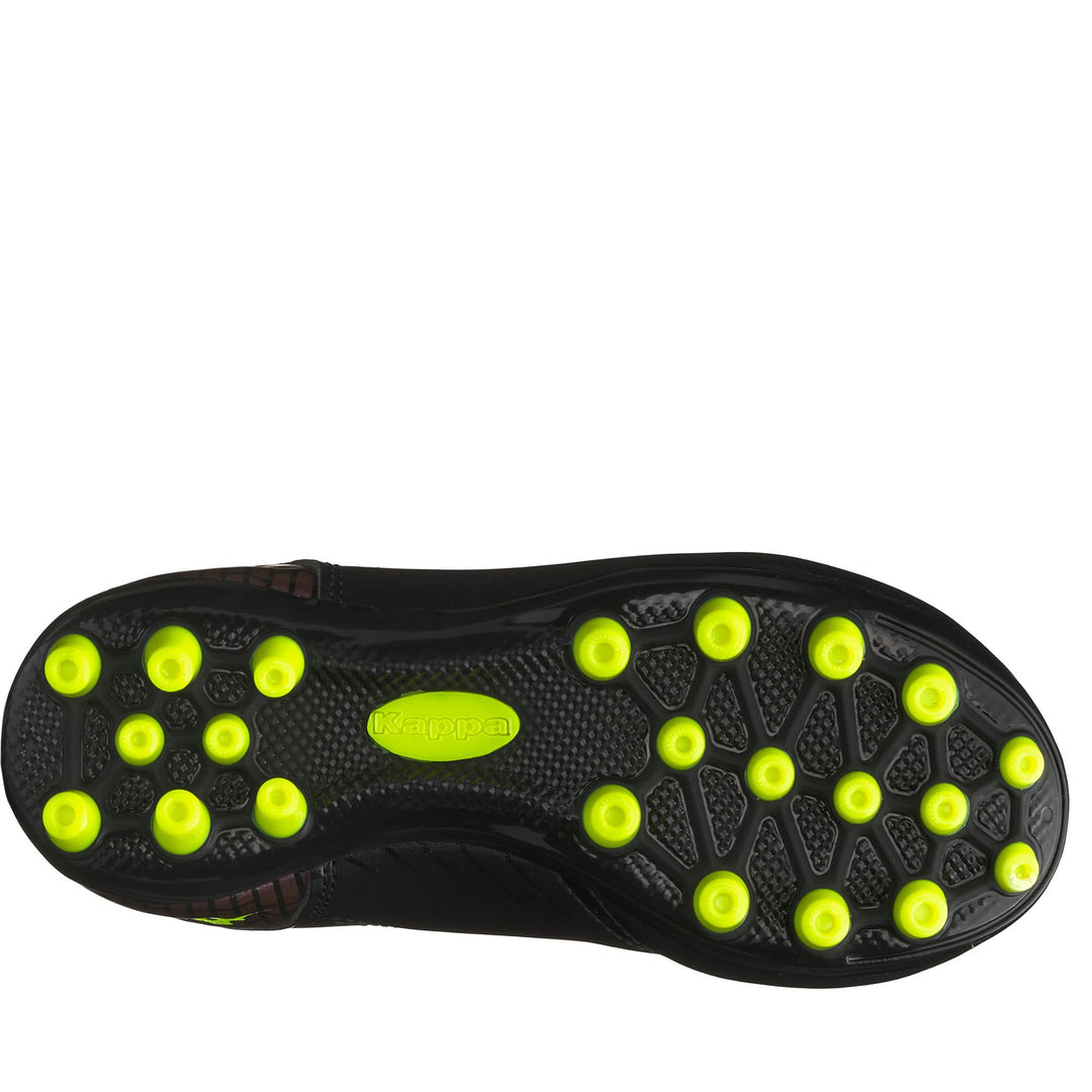 Botas técnicas de fútbol para niño en color negro y amarillo neón main